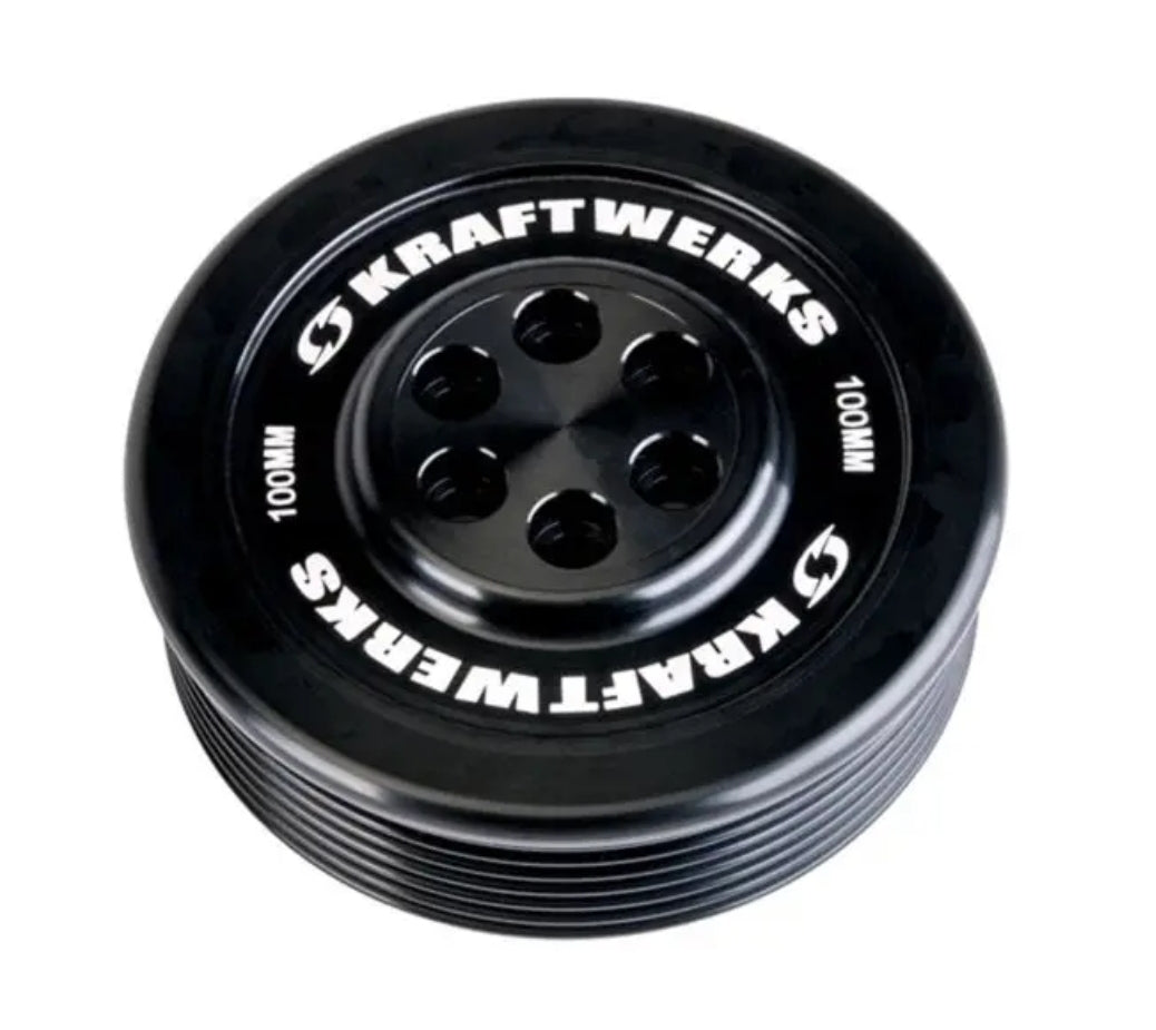 A close-up of a 100MM 7 rib Kraftwerks black anodized billet pulley for a Supercharged Honda civic.