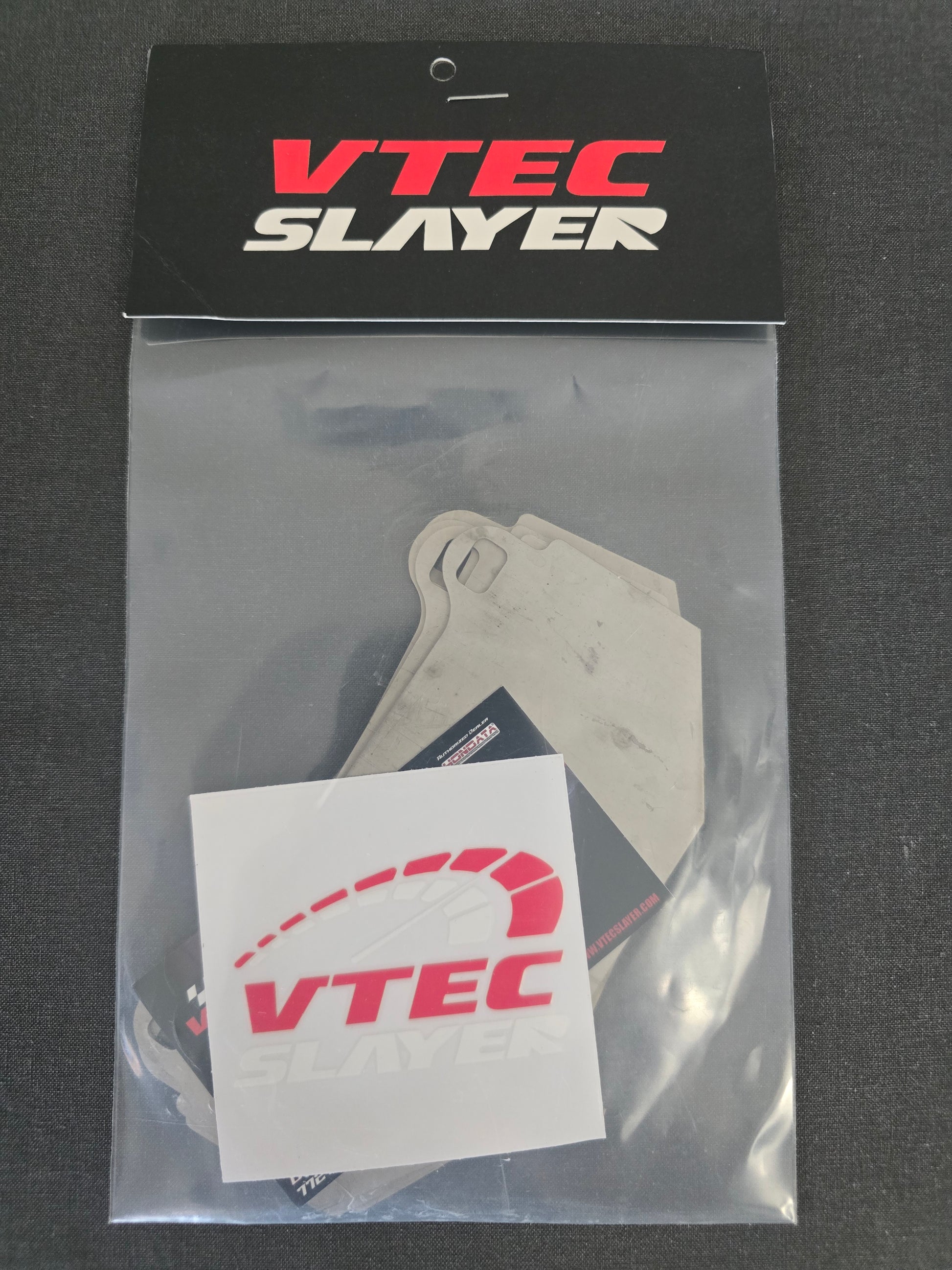 Vtec Slayer Titanium Front Brake Pad Shims for a 10th and 11th Gen Honda Civic Type R FK8/FL5 (2017-2026) packaged and showing logo.