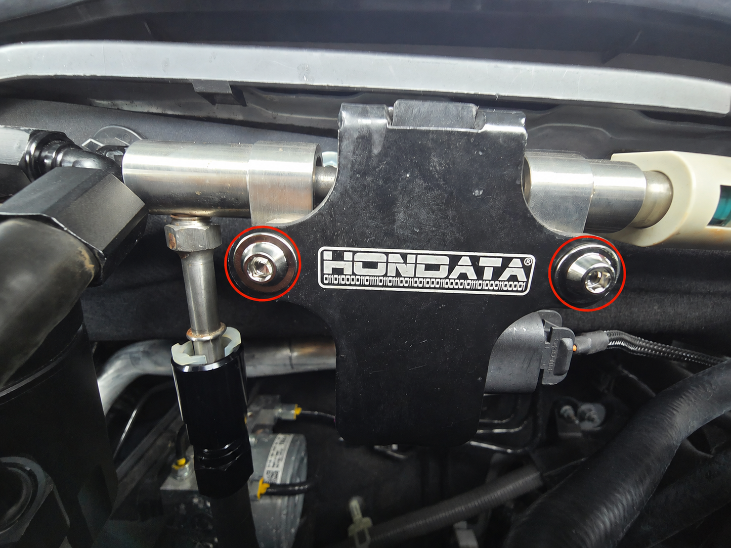 Close up of Aerospace-grade titanium CANFlex dress-up bolts for Hondata CANFlex Kit